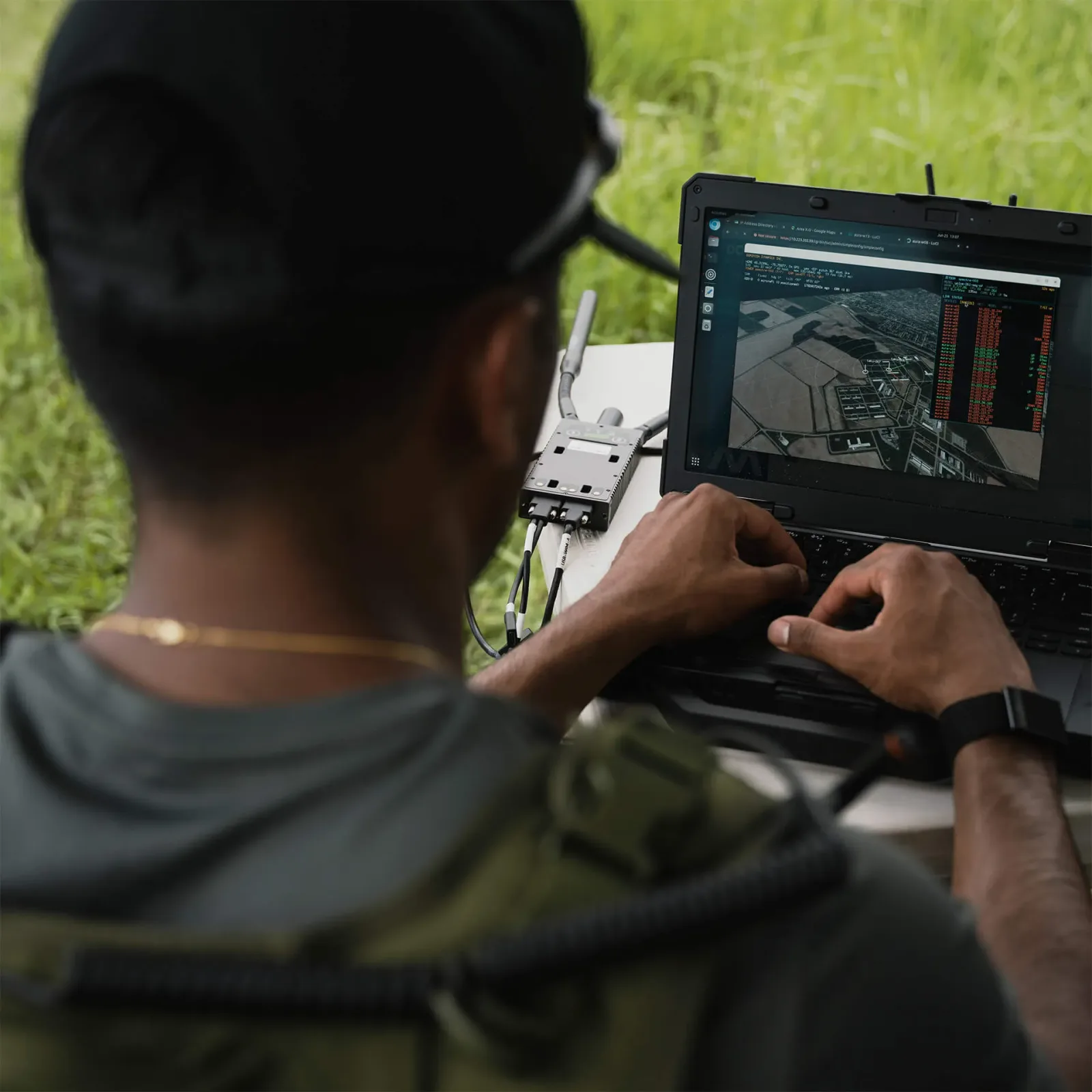 Field operator using a rugged laptop, pictured by Dominion Dynamics.