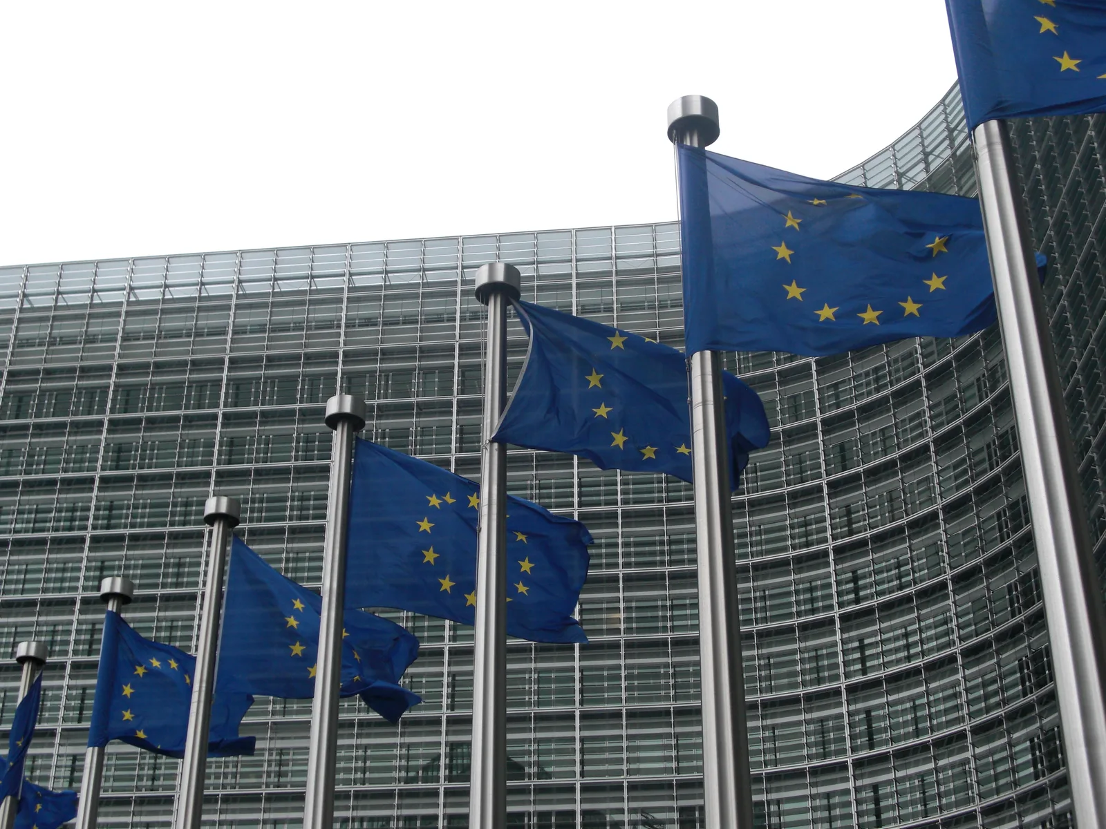 European Union flags outside the European Commission building in Brussels.