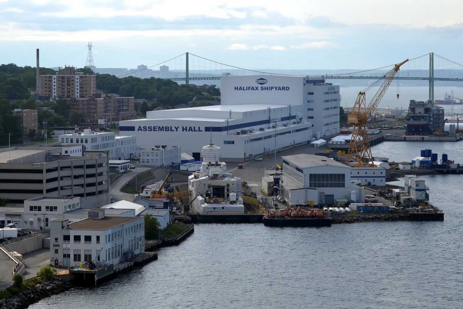 Halifax Shipyard assembly halls, cranes and vessels seen from the Macdonald Bridge.