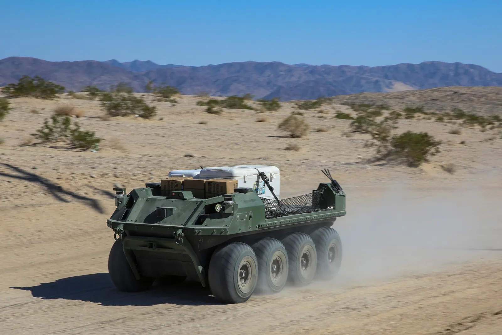 A Mission Master uncrewed ground vehicle carries cargo during a U.S. Marine Corps exercise.
