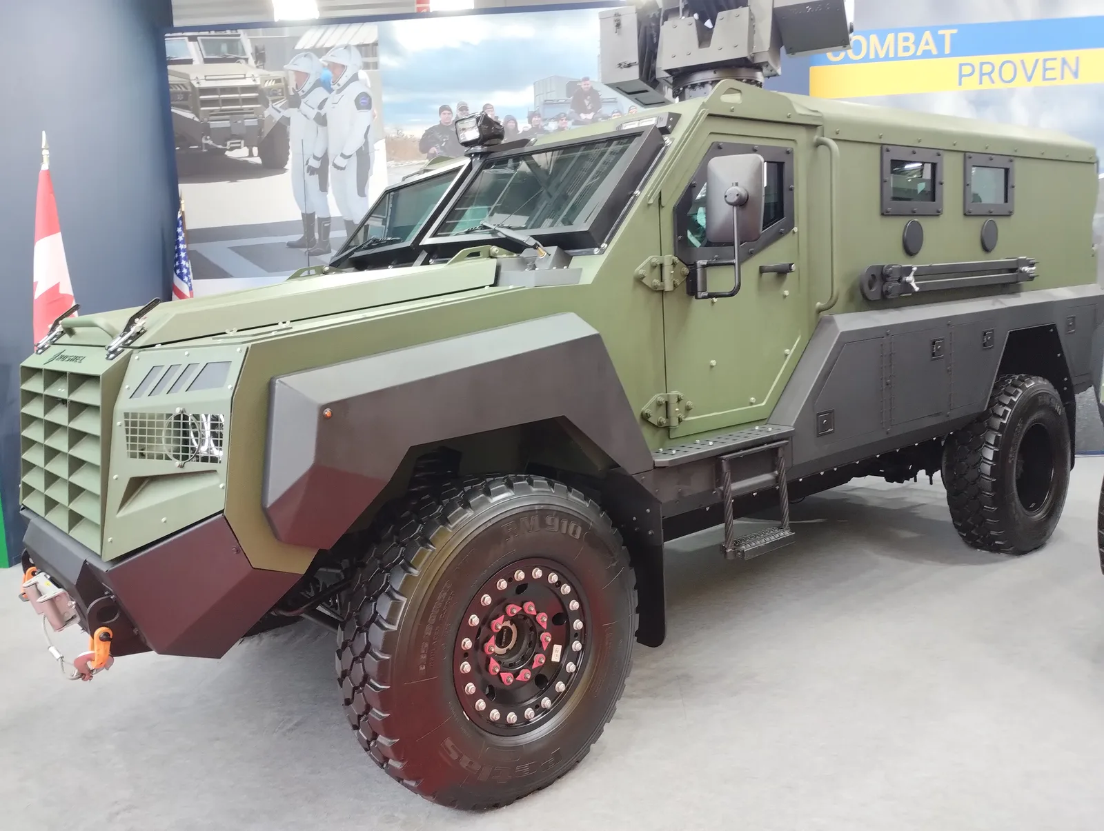 Roshel Senator armoured vehicle beside a Canadian flag at the MSPO 2024 defence exhibition in Kielce, Poland.