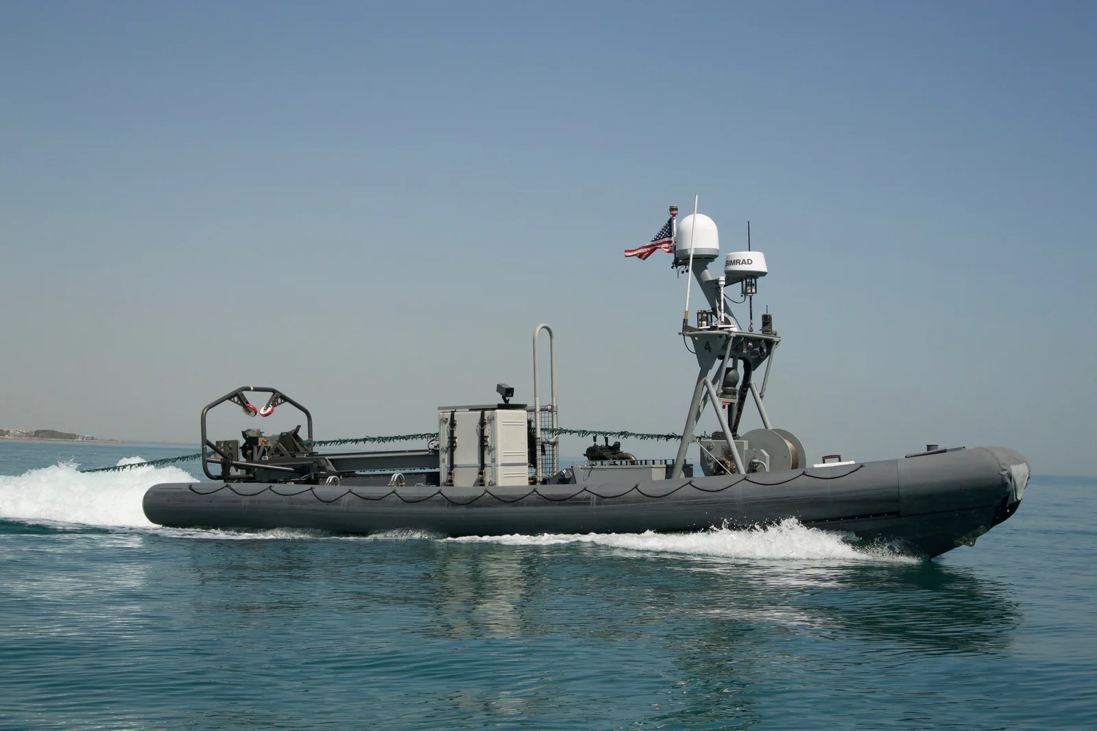 A U.S. Navy uncrewed surface vessel carries minehunting sonar equipment off Kuwait.